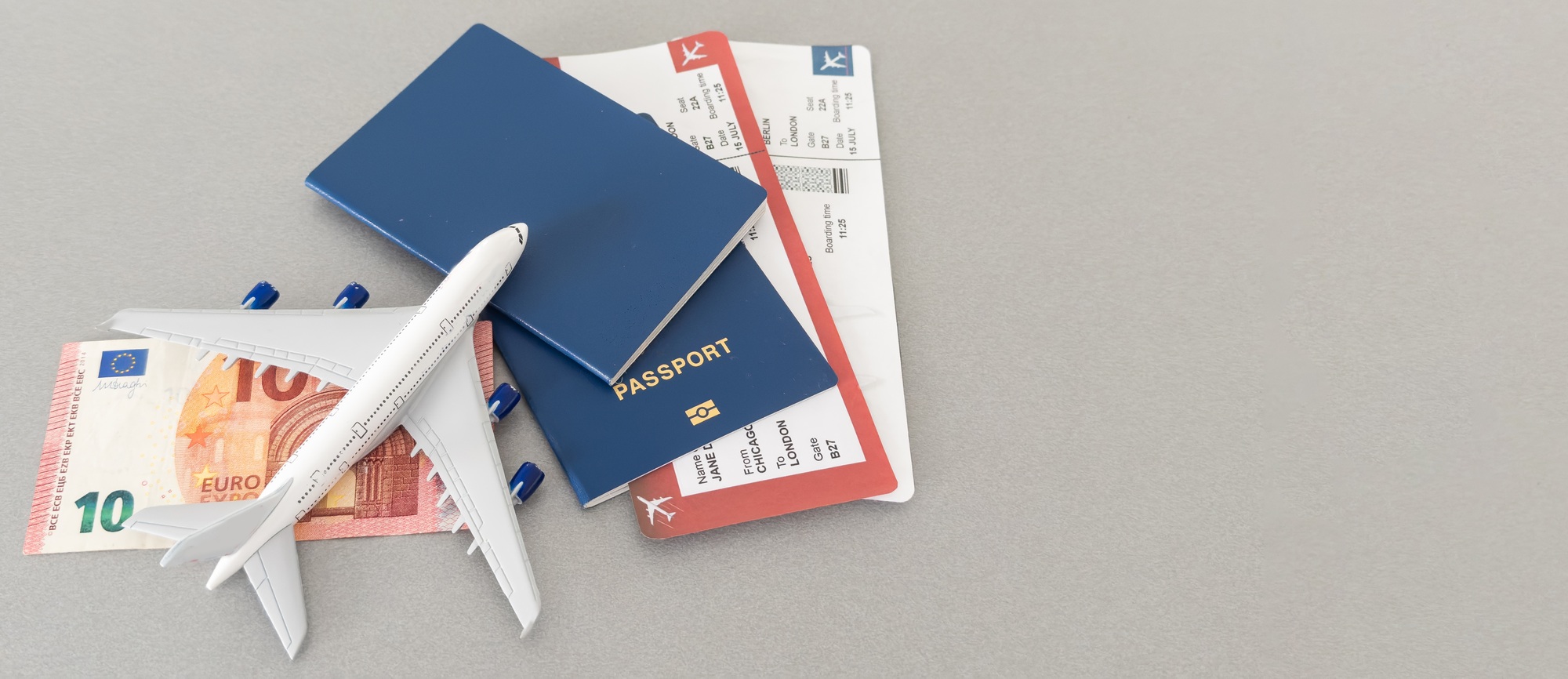 Top view of traveler accessories, passports and air tickets on background with copy space for text